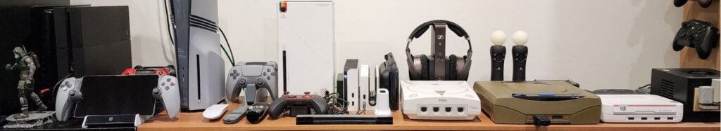 Image of a PC and assorted video game consoles connected to a TV.